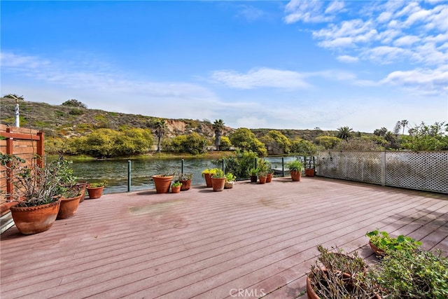 wooden terrace with a water view