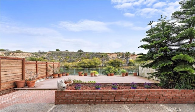 476 62nd St, Newport Beach, CA 92663 - fenced backyard with a wooden deck and a patio area
