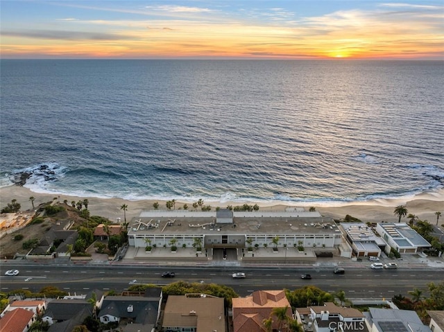 drone / aerial view with a water view and a residential view