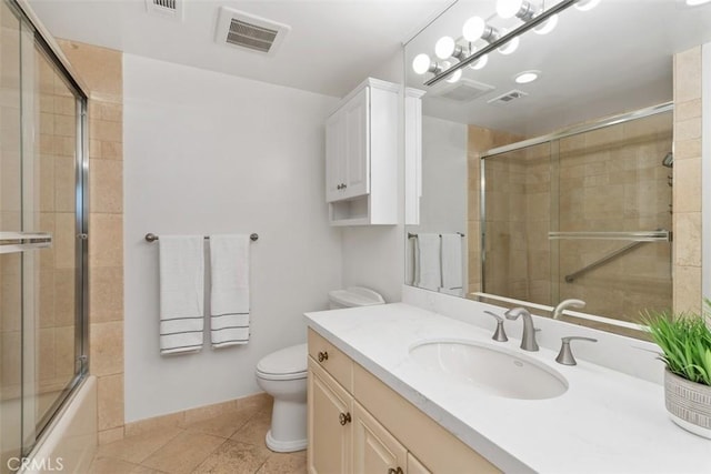 full bath featuring visible vents, toilet, combined bath / shower with glass door, vanity, and tile patterned flooring