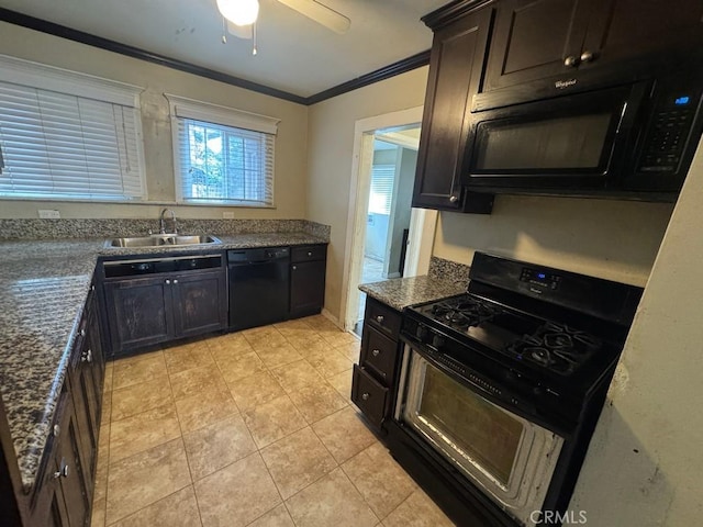 kitchen featuring a sink, dark brown cabinets, black appliances, dark stone countertops, and crown molding