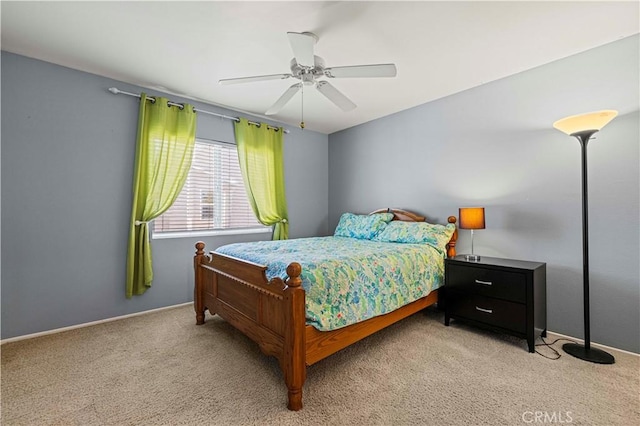 bedroom featuring a ceiling fan and light carpet