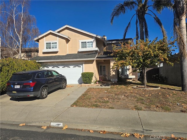 traditional-style house with driveway and a garage