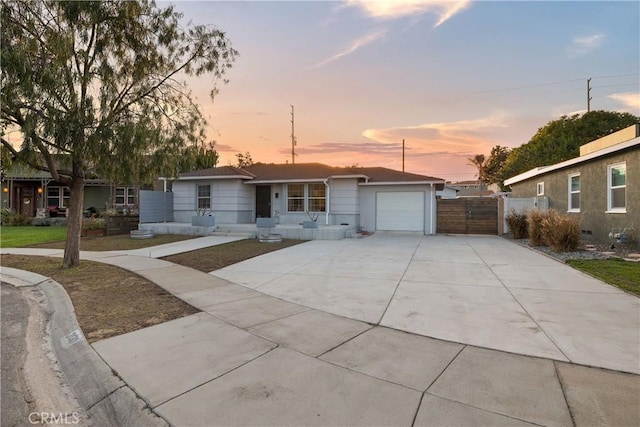 single story home featuring driveway and an attached garage