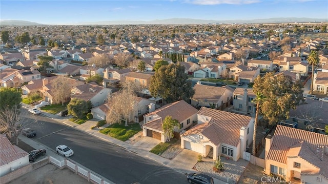 drone / aerial view with a mountain view and a residential view