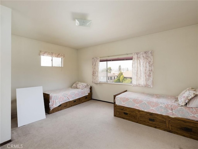 unfurnished bedroom featuring light carpet