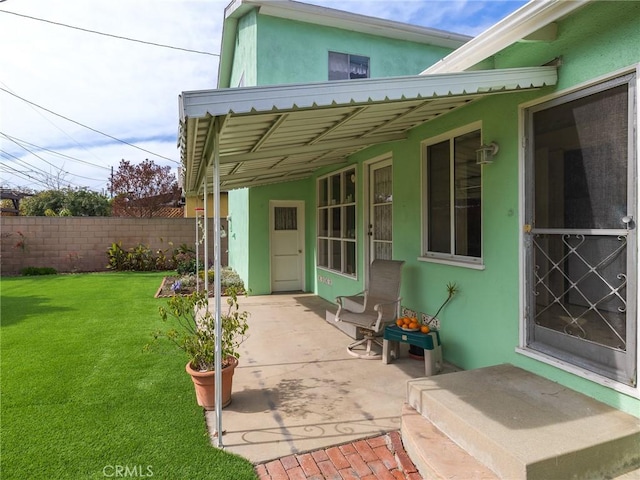 view of patio / terrace featuring fence