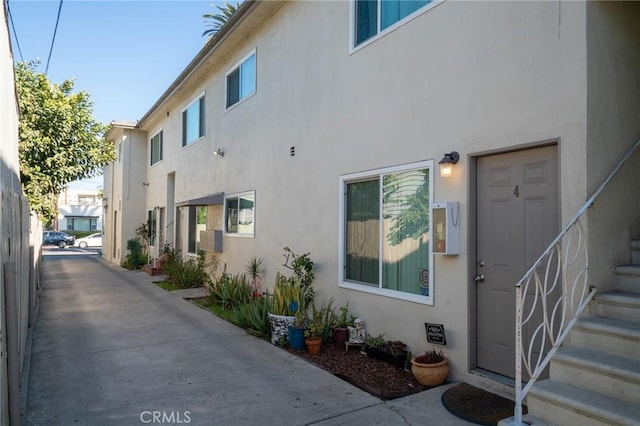 view of side of home featuring stucco siding