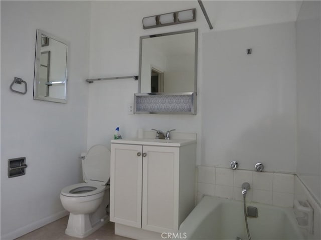 bathroom featuring toilet, a garden tub, and vanity