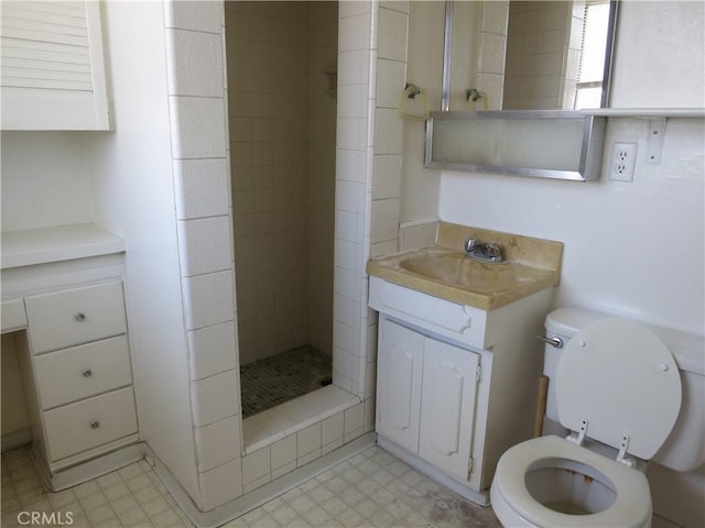 full bath with vanity, a shower stall, toilet, and tile patterned floors