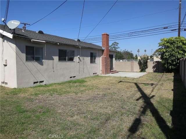 view of yard featuring a patio area and a fenced backyard