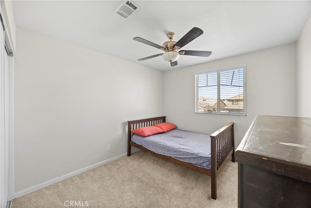 carpeted bedroom with a ceiling fan, baseboards, and visible vents