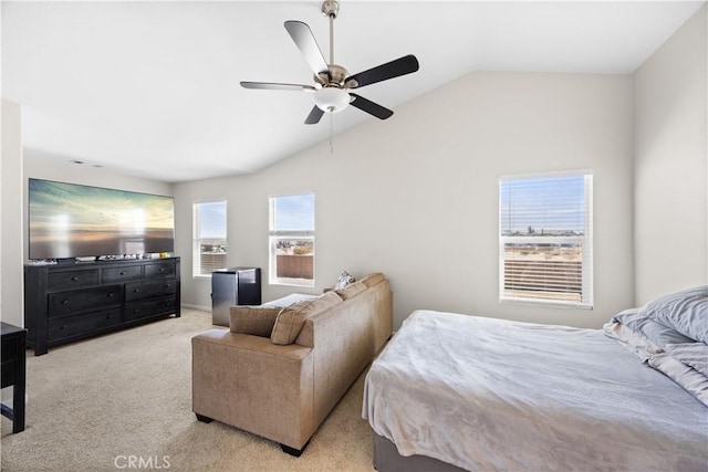 carpeted bedroom with a ceiling fan and lofted ceiling