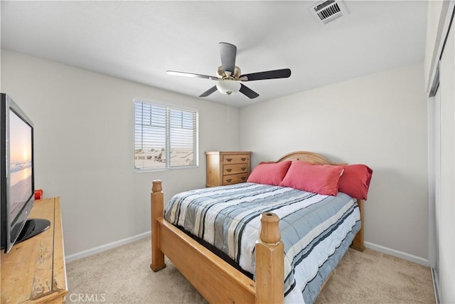 bedroom with a ceiling fan, carpet, visible vents, and baseboards