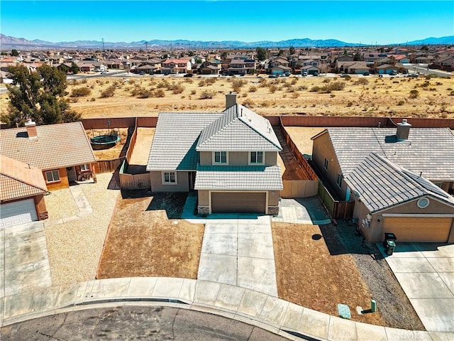 drone / aerial view with a mountain view and a residential view