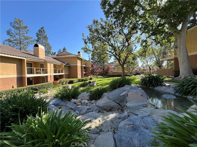 10655 Lemon Ave Unit 3808, Rancho Cucamonga, CA 91737 - view of yard with a garden pond