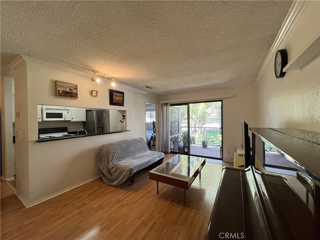 10655 Lemon Ave Unit 3808, Rancho Cucamonga, CA 91737 - living area with crown molding, wood finished floors, and a textured ceiling
