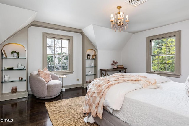 bedroom with baseboards, visible vents, lofted ceiling, dark wood-type flooring, and an inviting chandelier