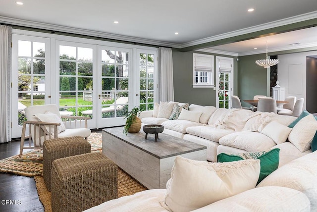 living area featuring recessed lighting, french doors, crown molding, and wood finished floors