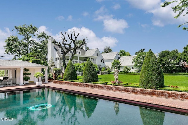 pool with a lawn and a residential view