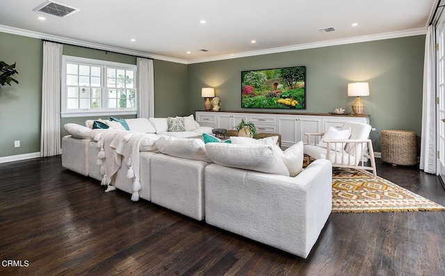 living room featuring dark wood-type flooring, visible vents, and crown molding