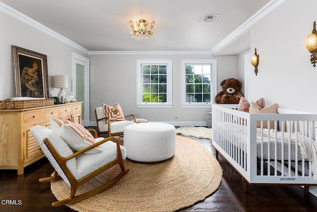 bedroom with dark wood-style floors, crown molding, visible vents, a chandelier, and baseboards