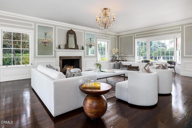 living area featuring a fireplace, ornamental molding, and a decorative wall