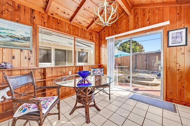 sunroom / solarium with lofted ceiling with beams, wood ceiling, and a notable chandelier