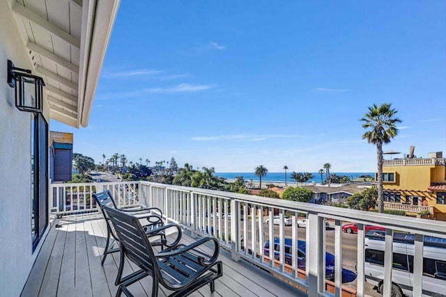 wooden terrace with a water view