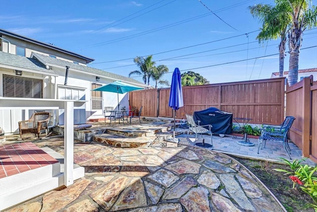 view of patio / terrace featuring a fenced backyard and grilling area