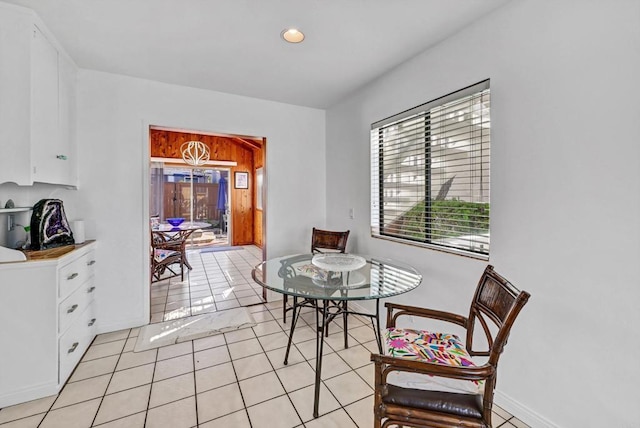 dining room with light tile patterned floors, baseboards, and recessed lighting