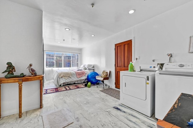 washroom with laundry area, washing machine and dryer, marble finish floor, and recessed lighting