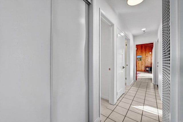 hall featuring light tile patterned floors