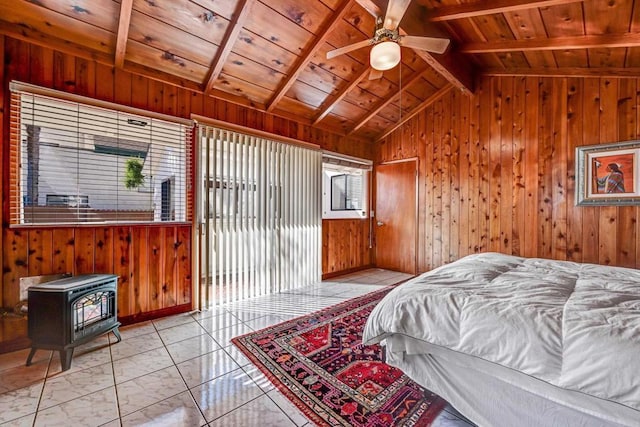 bedroom featuring vaulted ceiling with beams, wood ceiling, wood walls, and a wood stove