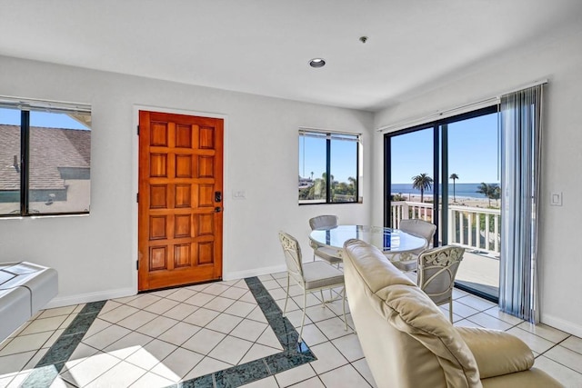 dining room featuring light tile patterned floors, baseboards, a wealth of natural light, and recessed lighting