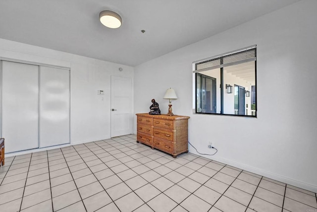 bedroom featuring a closet and baseboards