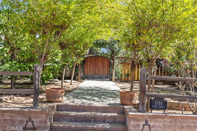 exterior space featuring fence and a gate