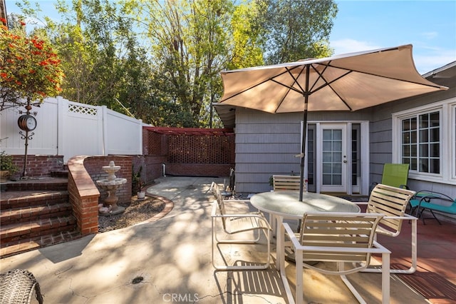 view of patio featuring fence