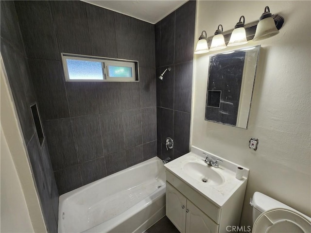 bathroom with toilet, bathtub / shower combination, and vanity