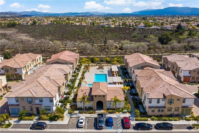 drone / aerial view featuring a residential view and a mountain view