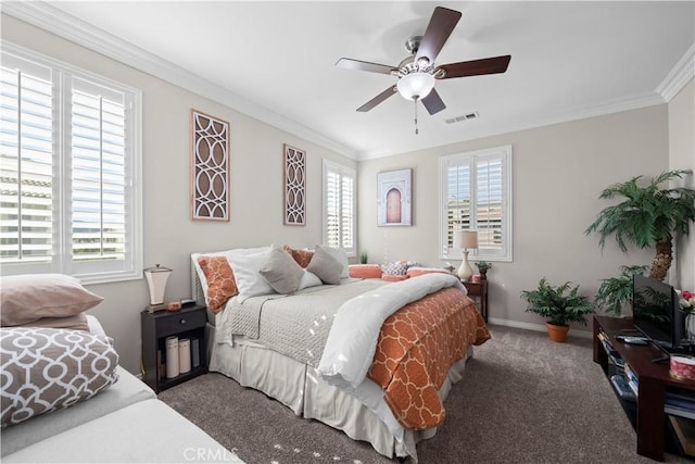 bedroom featuring multiple windows, visible vents, and crown molding