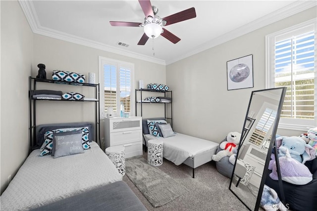 bedroom featuring a ceiling fan, carpet, visible vents, and crown molding