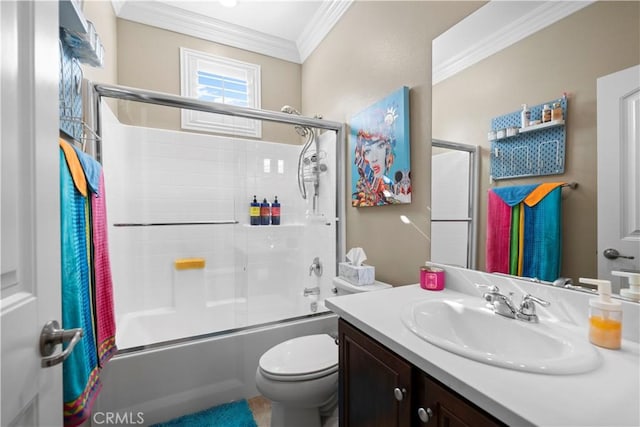 bathroom featuring toilet, enclosed tub / shower combo, ornamental molding, and vanity