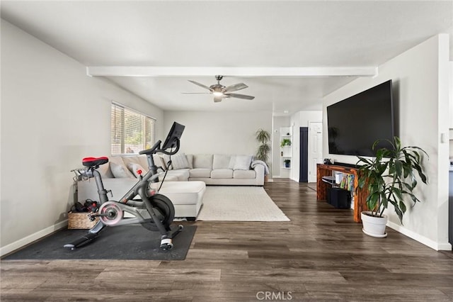 exercise room featuring baseboards, dark wood finished floors, and a ceiling fan