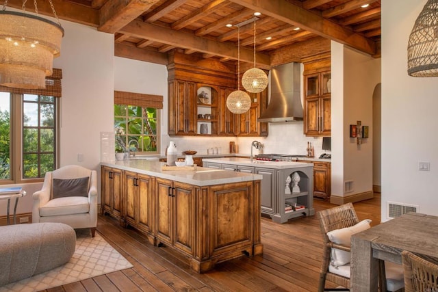 5423 Calzada Del Bosque, Rancho Santa Fe, CA 92067 - kitchen featuring wall chimney range hood, open shelves, brown cabinets, dark wood-style flooring, and a wooden ceiling with exposed beams