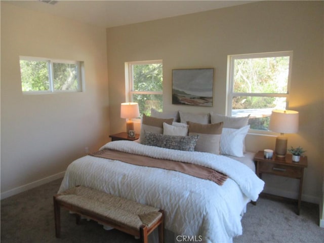 carpeted bedroom with baseboards