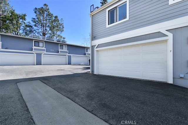 garage featuring driveway