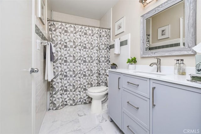 bathroom featuring marble finish floor, vanity, and toilet