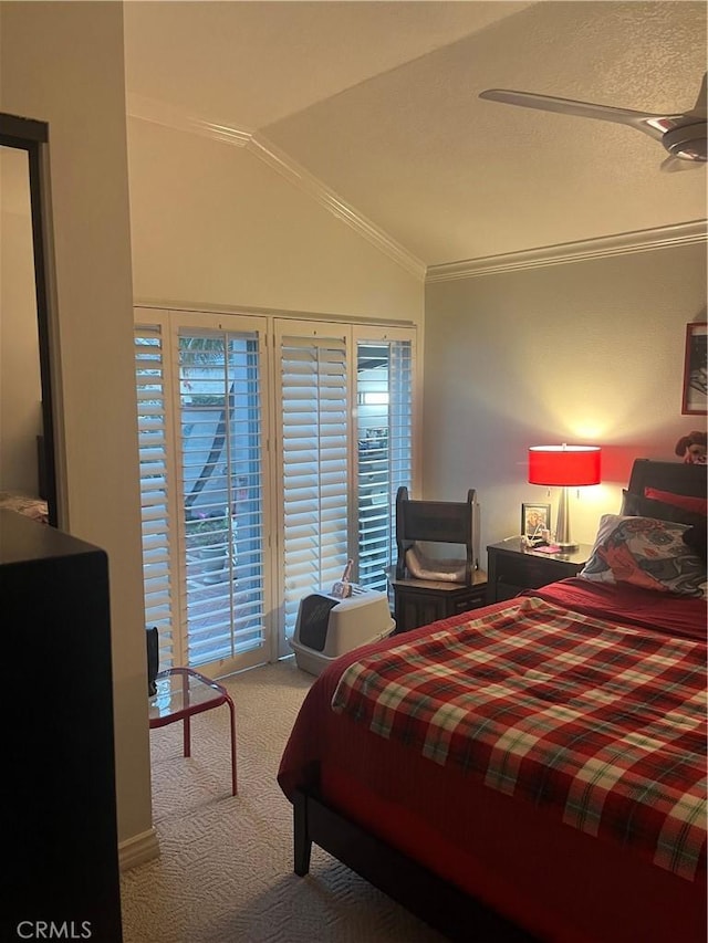 bedroom featuring access to exterior, carpet, crown molding, and lofted ceiling