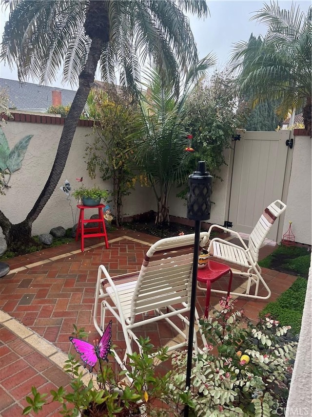 view of patio / terrace featuring fence